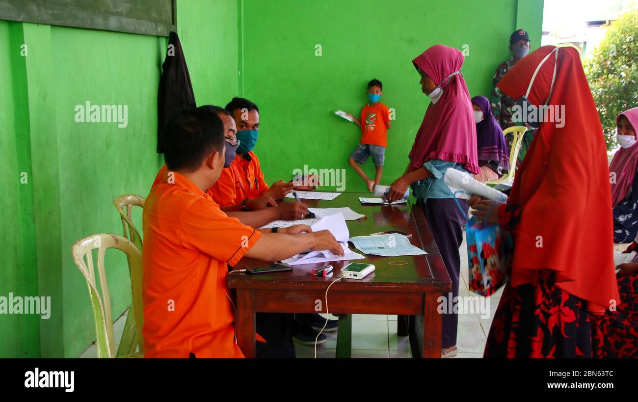 BLURRY and soft focus images of, residents when receiving cash assistance from the government, due to covid pandemic 19, Batang Indonesia, May 13, 202 Stock Photo