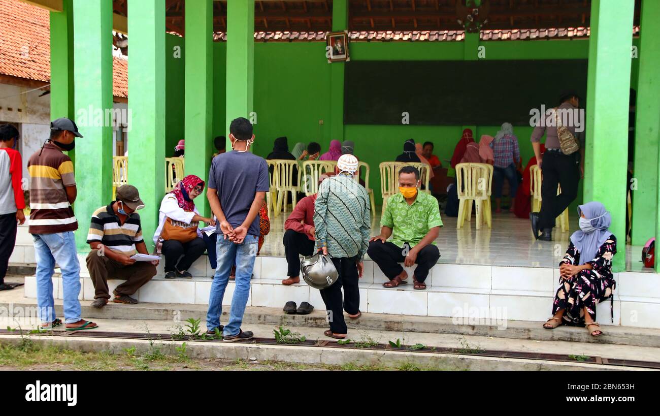 BLURRY and soft focus images of, residents when receiving cash assistance from the government, due to covid pandemic 19, Batang Indonesia, May 13, 202 Stock Photo