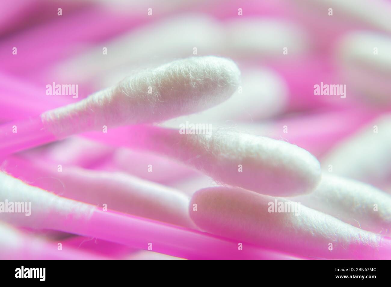 Pink colour Ear buds or Cotton swabs used for cleaning ears in a soft