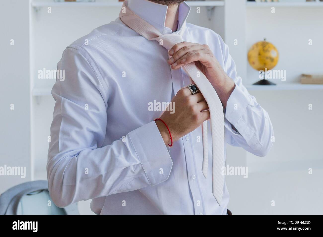 Businessman man puts on blue hi-res stock photography and images - Alamy