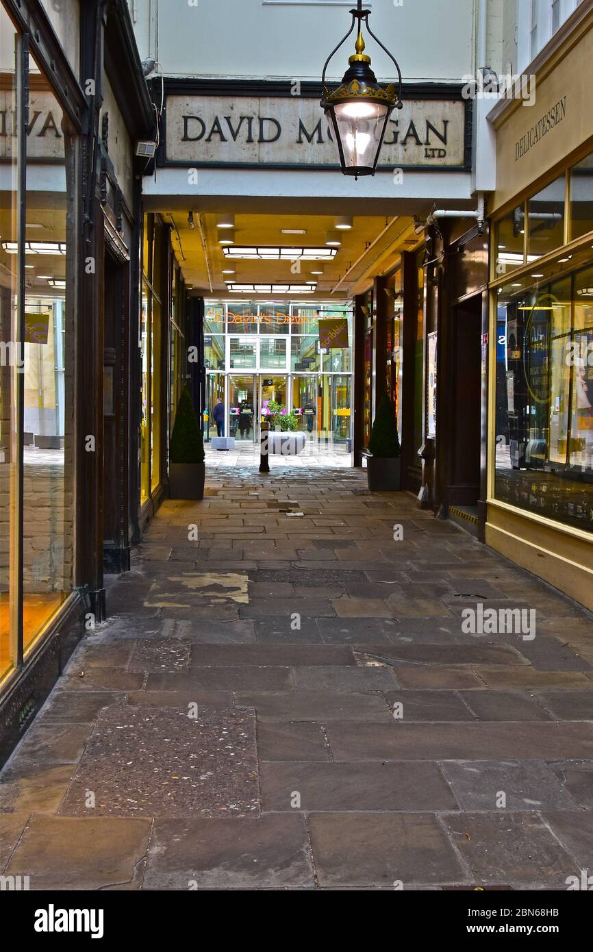 A view along the Royal Arcade in Cardiff,with the entrance to St Davids Shopping Centre visible across the dividing street. (The Hayes). Stock Photo
