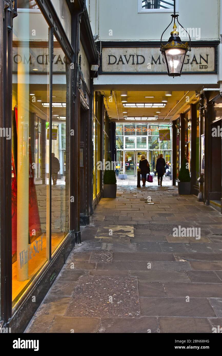 A view along the Royal Arcade in Cardiff,with the entrance to St Davids Shopping Centre visible across the dividing street. (The Hayes). Stock Photo