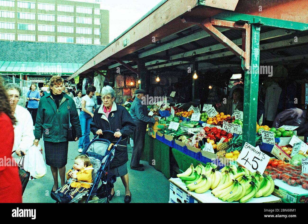1997 people shopping Wakefield town centre market , west Yorkshire, Northern England, shot on film & cross processed Stock Photo