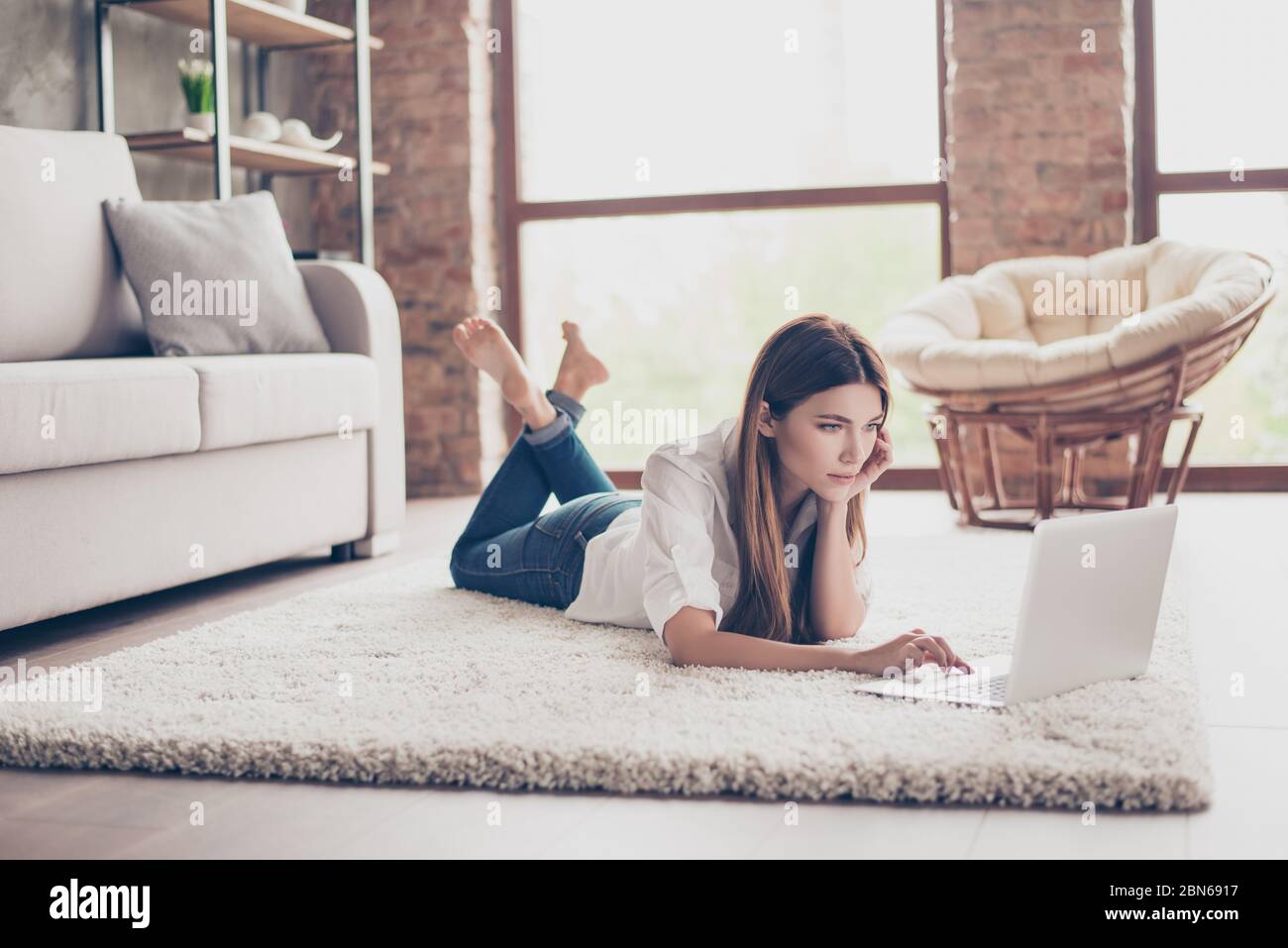Barefoot girl lying on couch hi-res stock photography and images - Alamy
