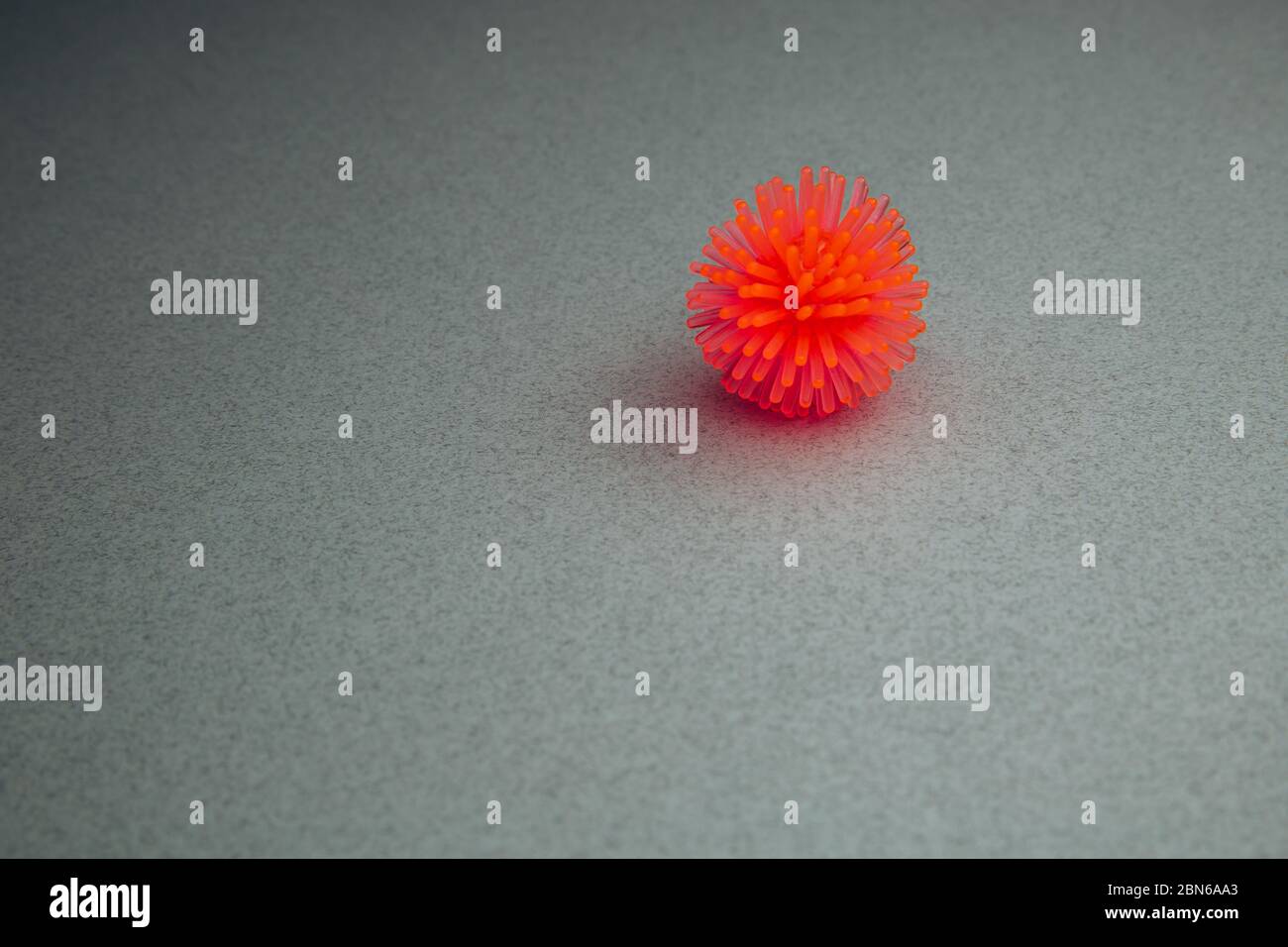 Abstract virus strain model of Coronavirus disease COVID-19 on a grey background. Virus Pandemic Protection Concept. Copy space. Stock Photo