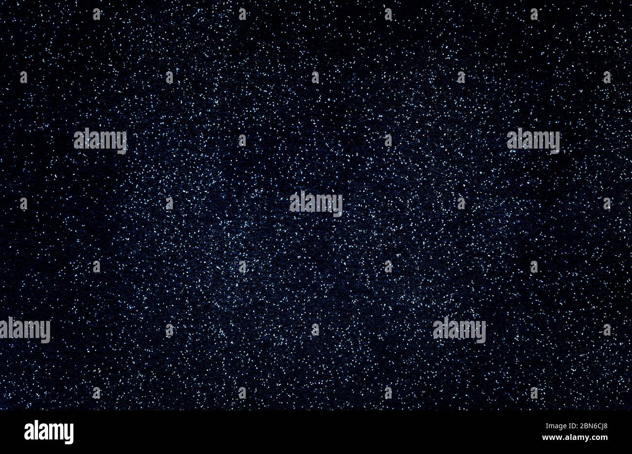 Dark abstract background with light dots and fine texture. Stock Photo
