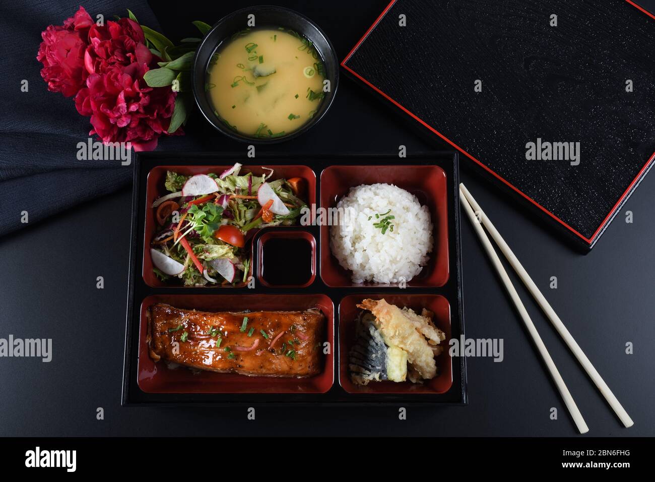 Fresh Food Portion in Japanese Bento Box with Sushi Rolls, Salad and ...
