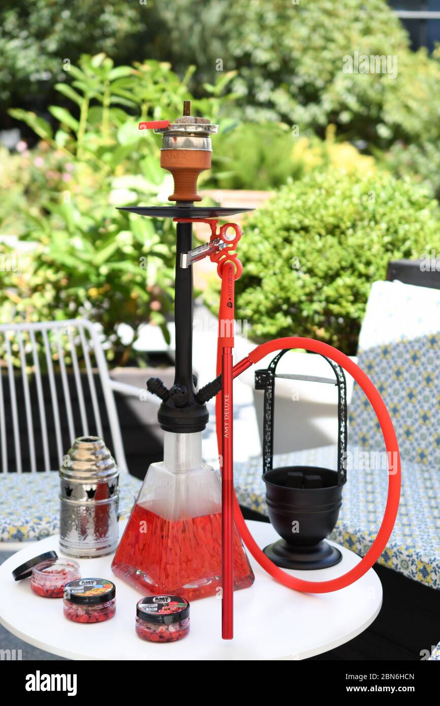 Shisha Hookah On Restaurant Table In The Garden Metal Hookah On A Summer Terrace With A Blurred Background Stock Photo Alamy Shisha Hookah On Restaurant Table In The Garden Metal Hookah On A Summer Terrace With A Blurred Background Stock Photo Alamy