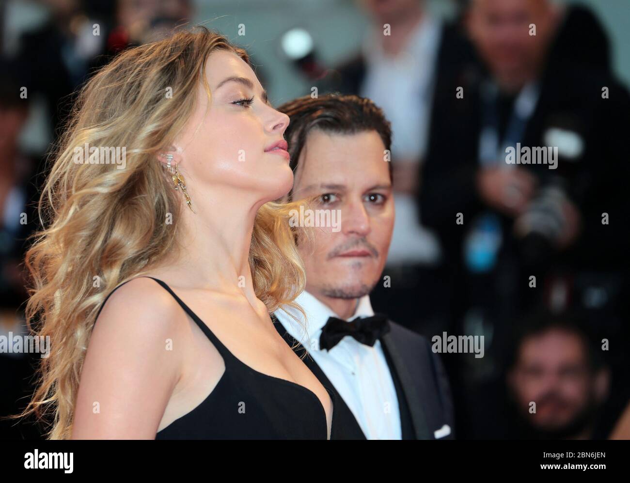 Johnny Depp and Amber Heard attends the 'Black Mass' red carpet during the 72nd Venice Film Festival on September 4, 2015 in Venice, Italy. Stock Photo