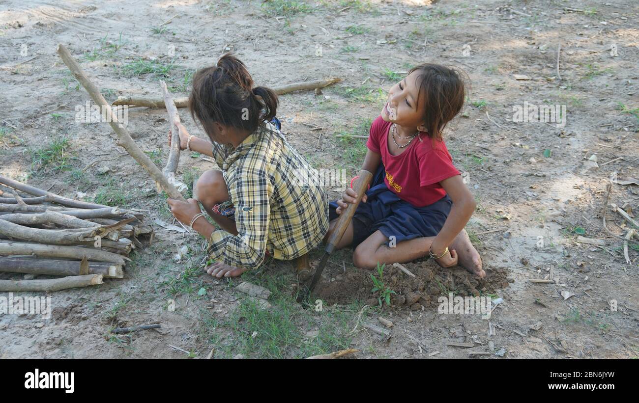 two laotian girls playing at the river shore Stock Photo