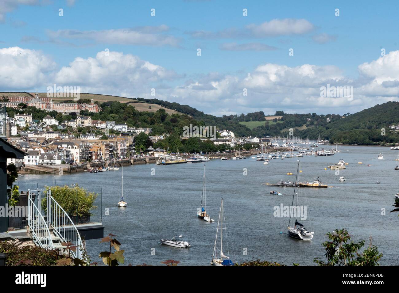 View looking towards Dartmouth Town centre / quayside and Britannia Royal Naval College On the top left above the town. Stock Photo