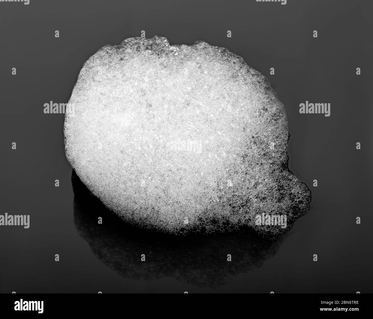 white soap foam on a black background Stock Photo - Alamy