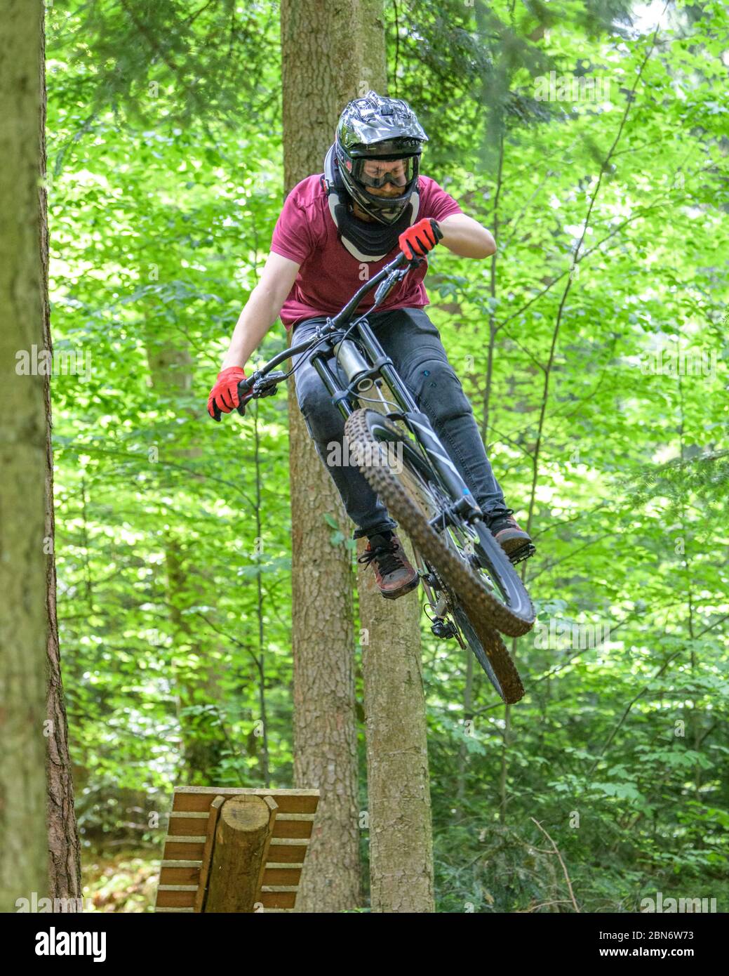 Jump session of professional young mountainbikers in a bike park in ...