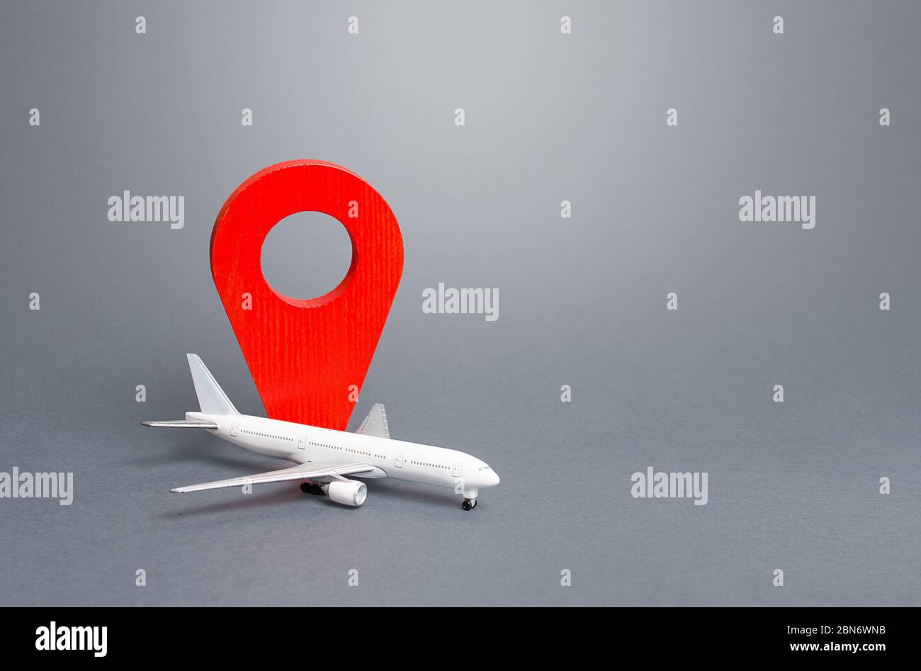 Passenger plane and red location indicator. Air travel. New rules for passengers transportation by air, quarantine measures. Support financial program Stock Photo