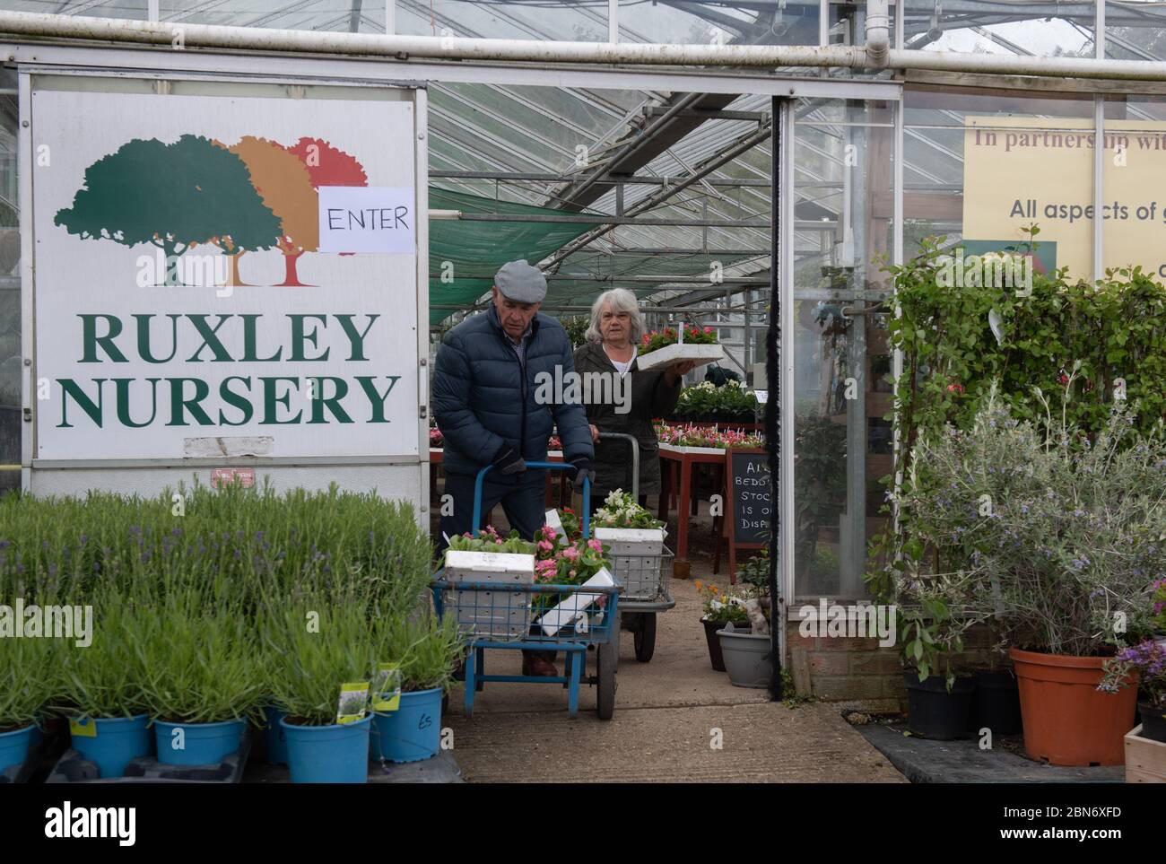 SIDCUP, KENT, UK. 13th May, 2020. Customers with their plants following the Government update to slowly release lockdown at Ruxley Nursery on Maidstone Road, Sidcup, Kent. Photo by Alan Stanford. Credit: PRiME Media Images/Alamy Live News Stock Photo