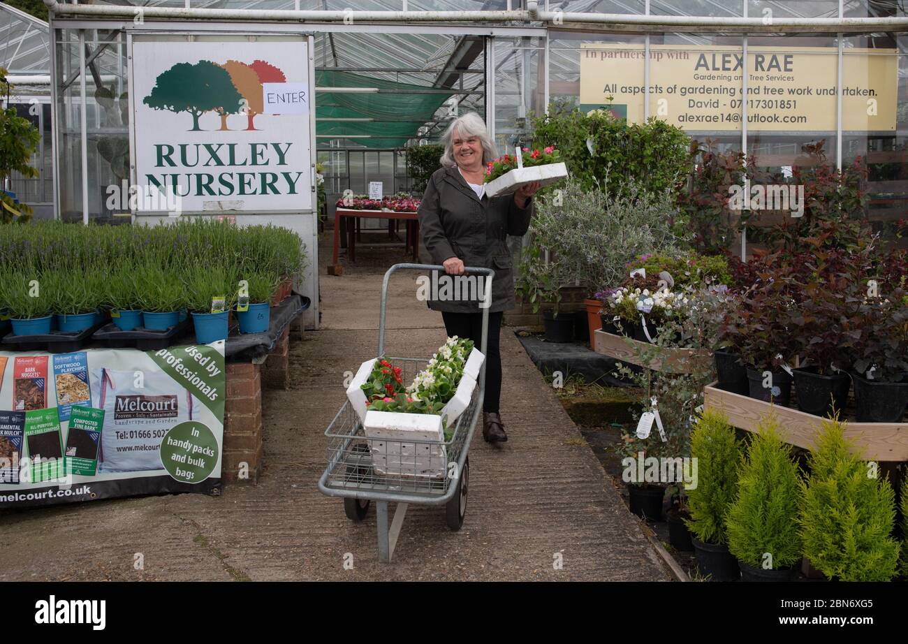 SIDCUP, KENT, UK. 13th May, 2020. Customers with their plants following the Government update to slowly release lockdown at Ruxley Nursery on Maidstone Road, Sidcup, Kent. Photo by Alan Stanford. Credit: PRiME Media Images/Alamy Live News Stock Photo