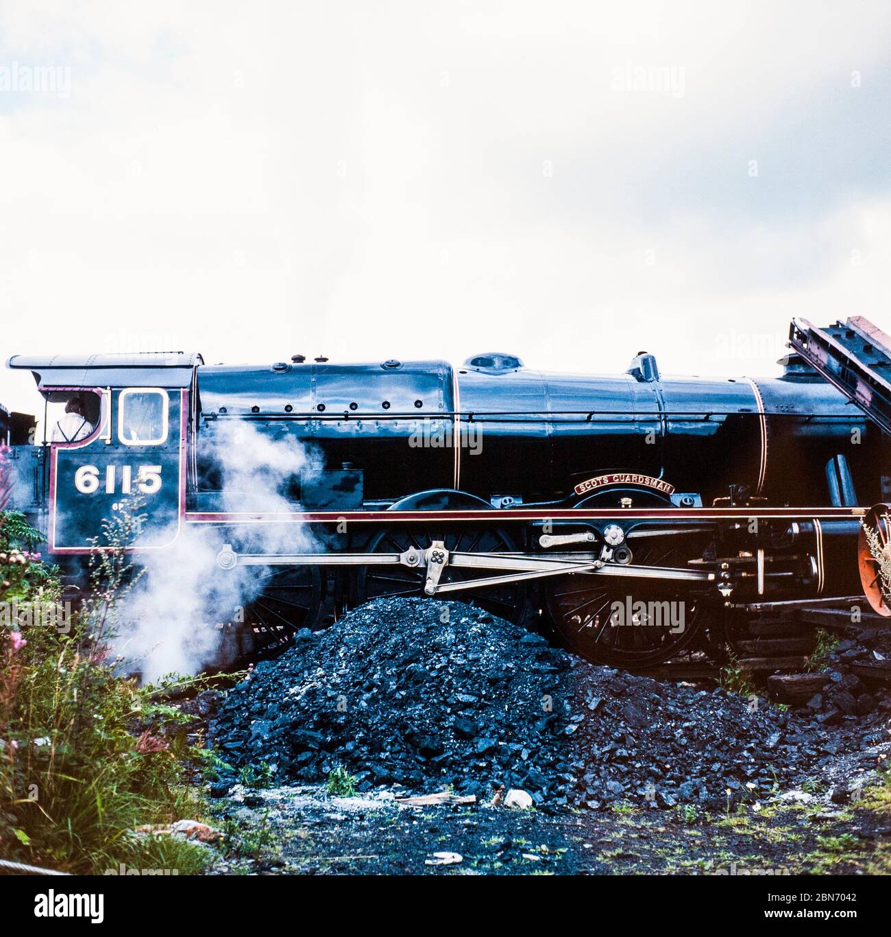 The Scots Guardsman Steam Locomotive 6115 fueling up, England, UK. Stock Photo