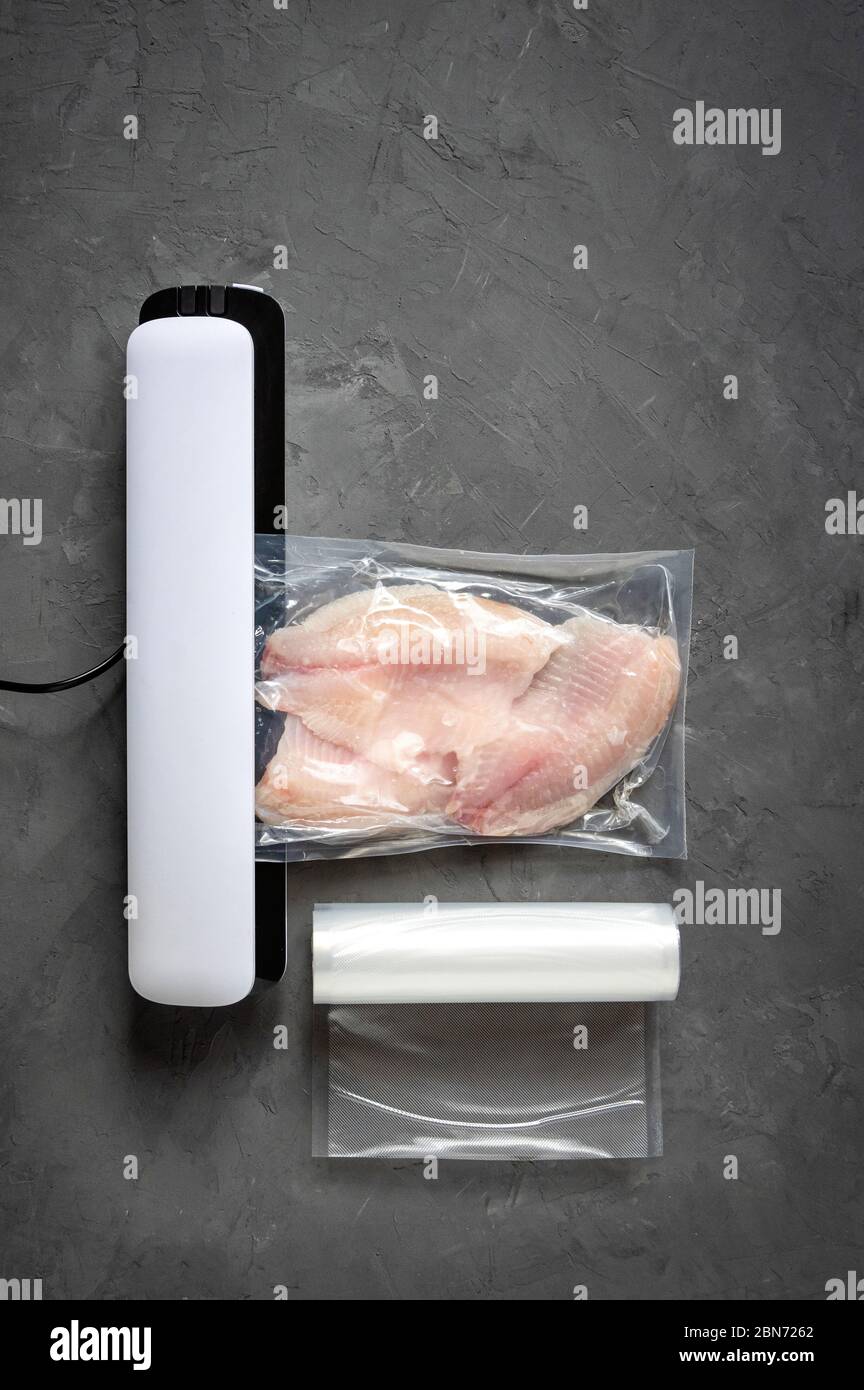 Tilapia fillet in a vacuum bag. Vacuum fish packaging for longterm