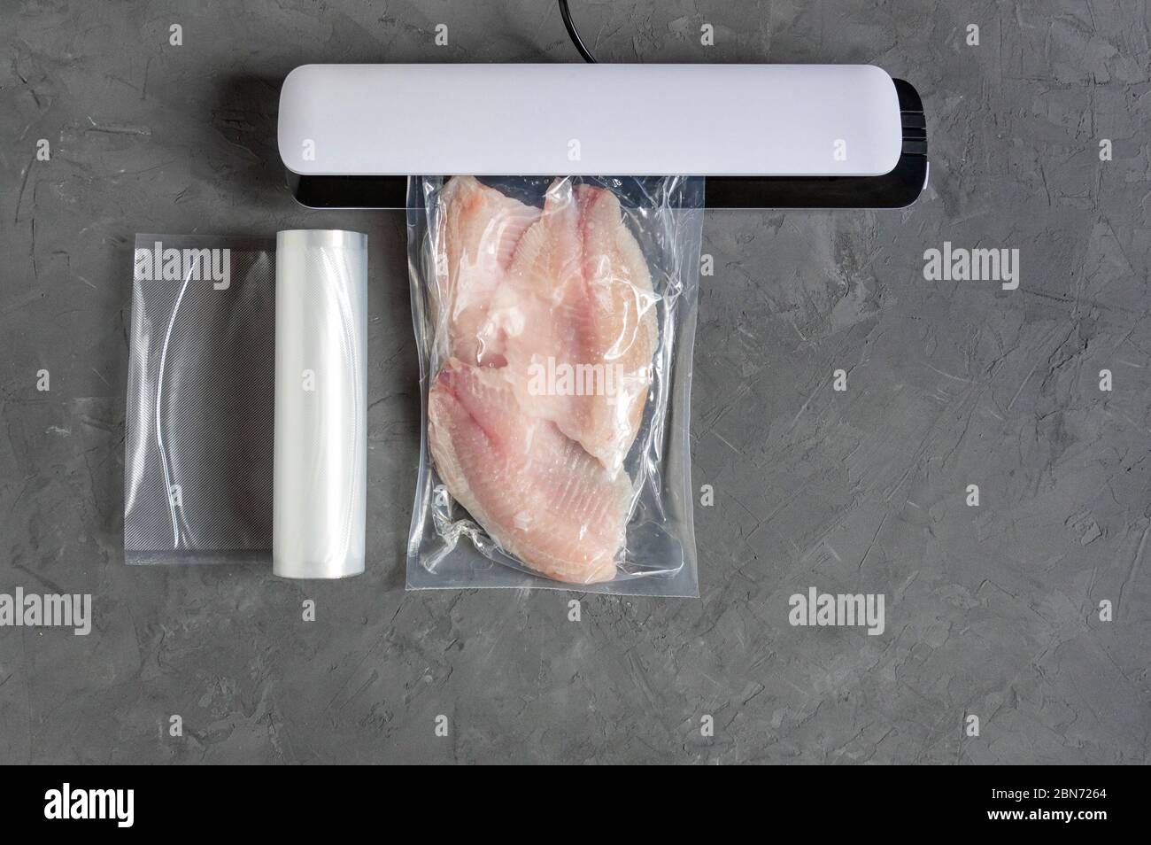 Vacuum fish packaging for longterm storage. Tilapia fillet in a vacuum