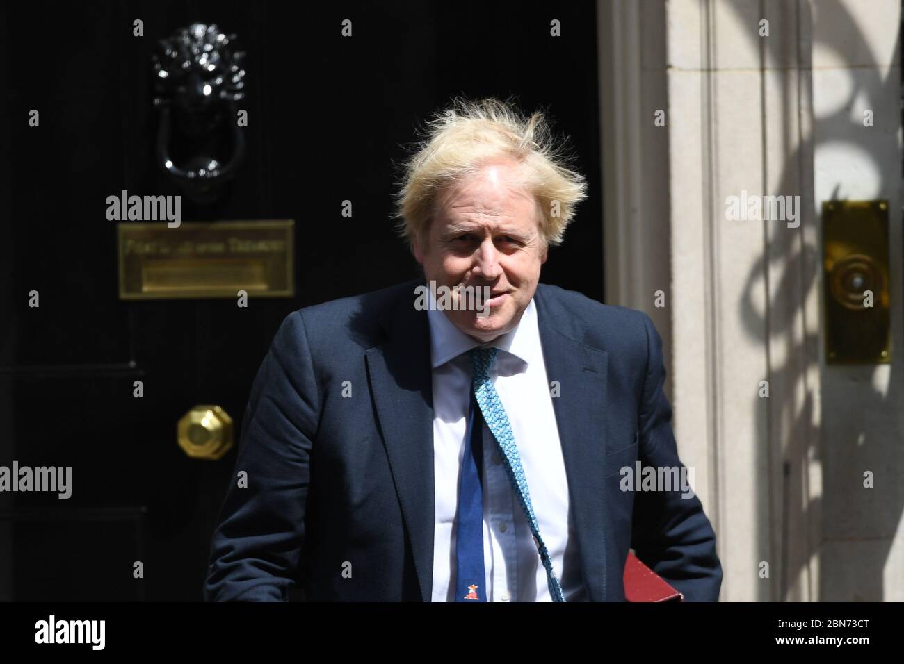 Prime Minister Boris Johnson leaves 10 Downing Street, London, for PMQs in the House of Commons, on the first day of the easing of coronavirus restrictions to bring the country out of lockdown. Stock Photo