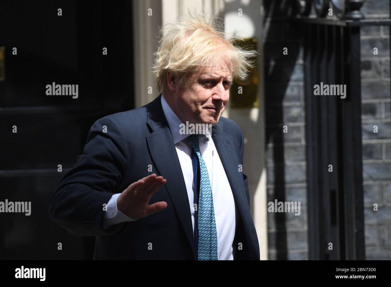 Prime Minister Boris Johnson leaves 10 Downing Street, London, for PMQs in the House of Commons, on the first day of the easing of coronavirus restrictions to bring the country out of lockdown. Stock Photo