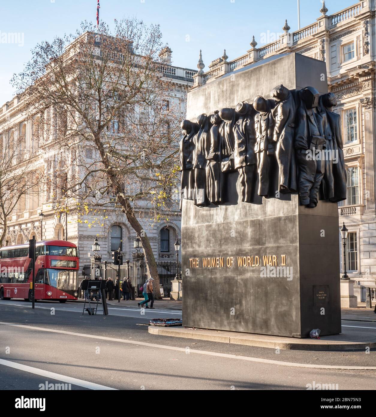 Monument to the Women of World War 2. Memorial on Whitehall, London, with background government buildings including Downing Street and Foreign Office. Stock Photo