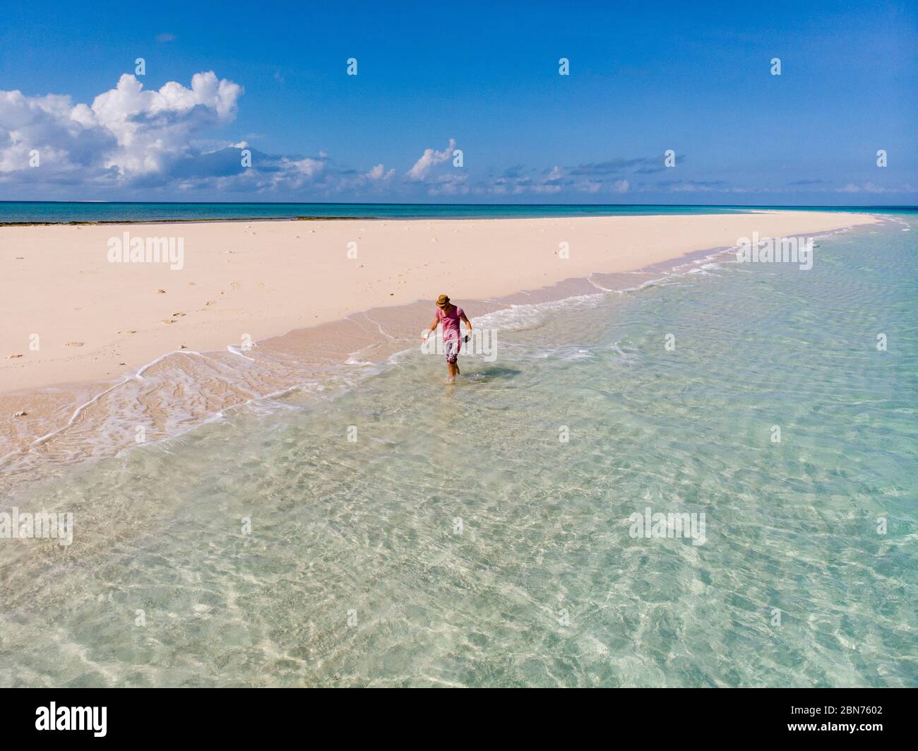 Traveller on Zanzibar. Empty beach at Snow-white sand bank of Nakupenda Island. Appearing just a few hours in a day. Aerial drone shot Stock Photo