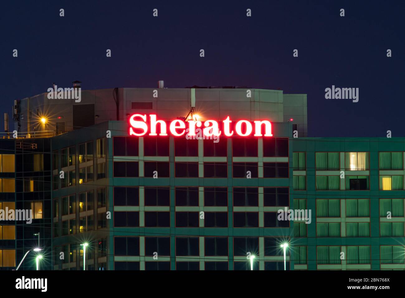 Sheraton Hotel logo shining bright in red atop of their hotel at Toronto Pearson, Terminal 3. Stock Photo