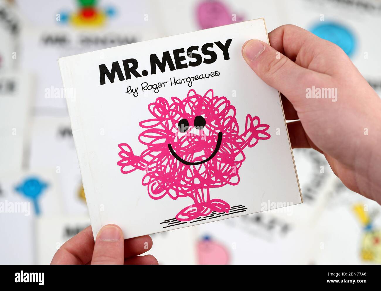 A boy about to read the Mr Men book, Mr Messy by Roger Hargreaves Stock Photo