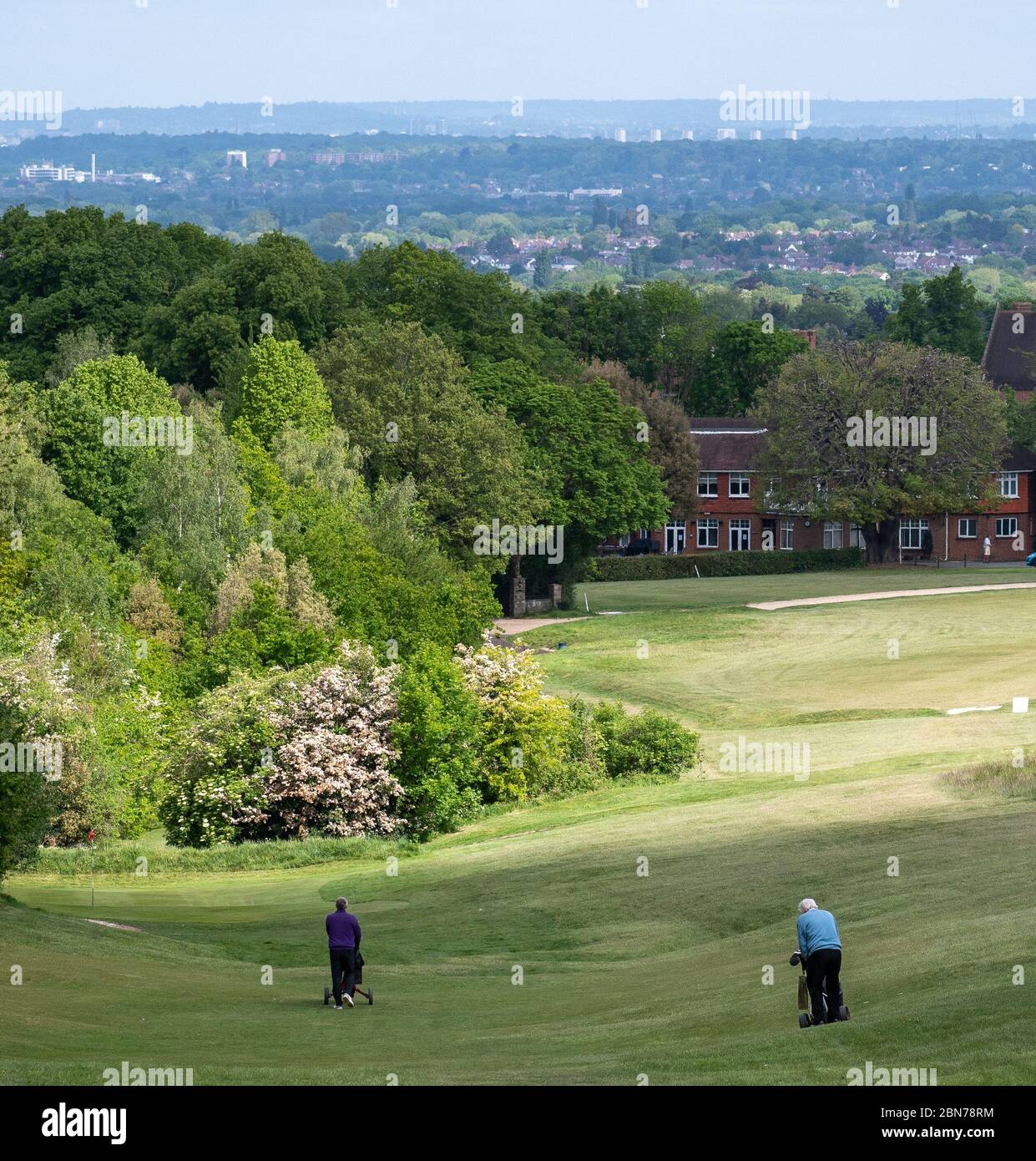 Golfers play at Epsom Downs Golf Club on the first morning after  restrictions are lifted at Epsom Downs, Epsom, Surrey Picture by Nigel  Bramley 078278 Stock Photo - Alamy