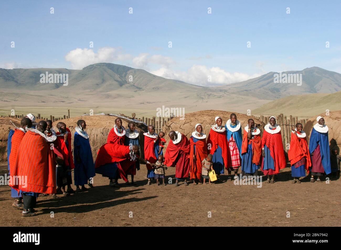 A Group of Maasai women in red robes. Maasai is an ethnic group of semi-nomadic people. Photographed in Tanzania Stock Photo