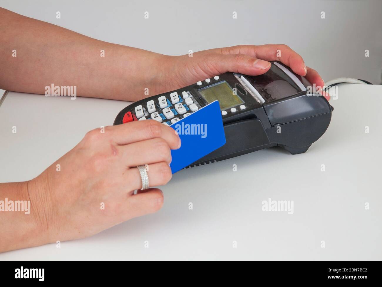 Payment by card through payment terminal Stock Photo