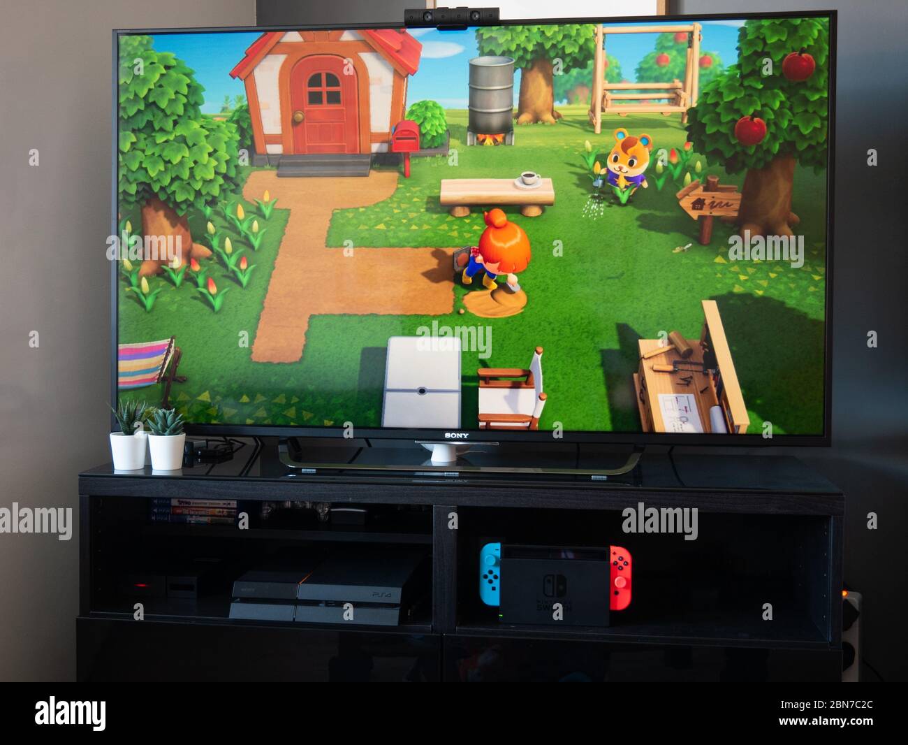 May 2020, UK: Nintendo switch games console on tv animal crossing new horizons Stock Photo