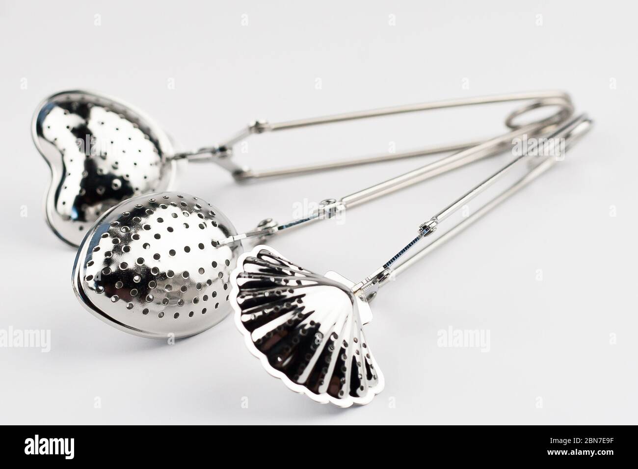 Different kinds of stainless tea strainers isolated on white background Stock Photo Alamy