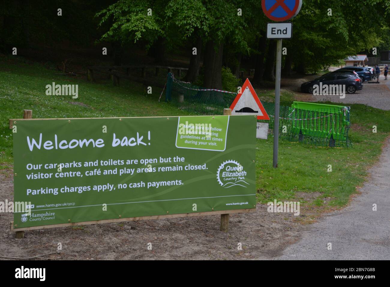 A sign welcoming visitors back to Queen Elizabeth Country Park near Petersfield, Hampshire, after the lifting of coronavirus lockdown restrictions on some leisure activities - including tennis, water sports, angling and golf. Stock Photo
