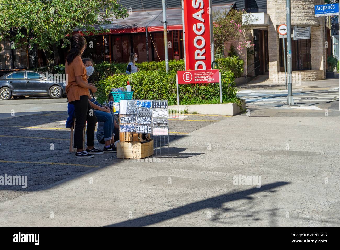 Women selling mask in an open air street market in Sao Paulo, Brazil, during the COVID19 corona crisis in May 2020. Stock Photo