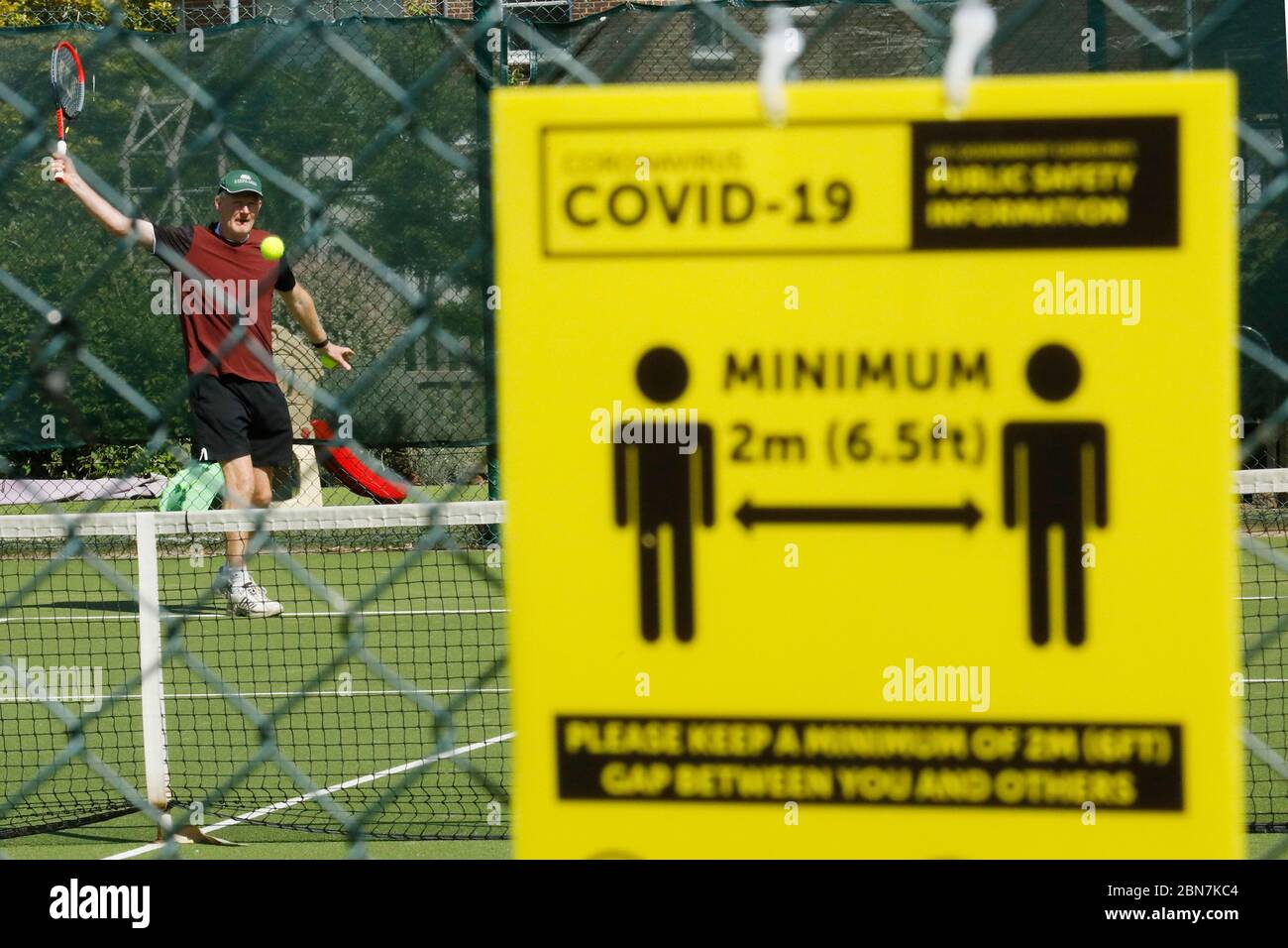 Portsmouth, UK. 13th May, 2020. Men play tennis taking advantage of the new more relaxed lockdown rules, at Southsea, near Portsmouth, UK Wednesday May 12, 2020 Photograph Credit: Luke MacGregor/Alamy Live News Stock Photo