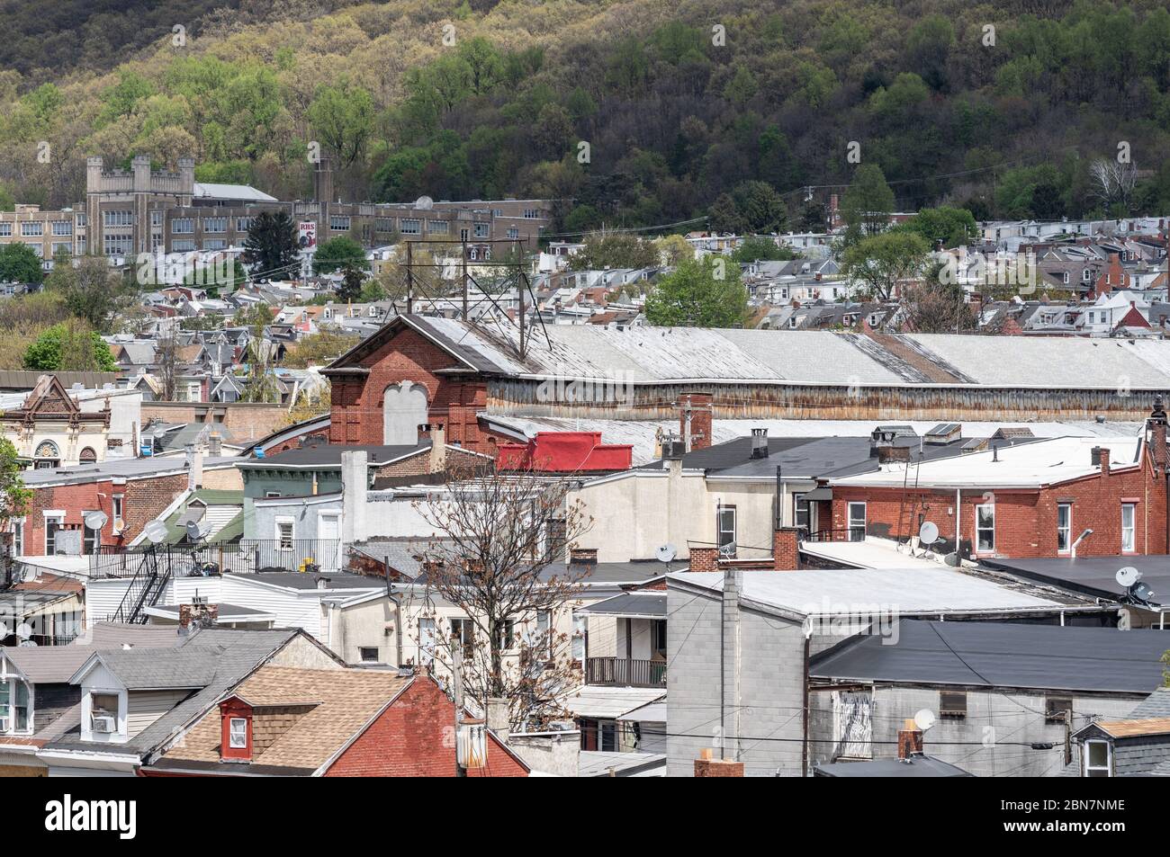 Reading, Pennsylvania-May 1: 2020: Aerial View of a Reading High School and roof tops of Reading Pennsylvania Stock Photo
