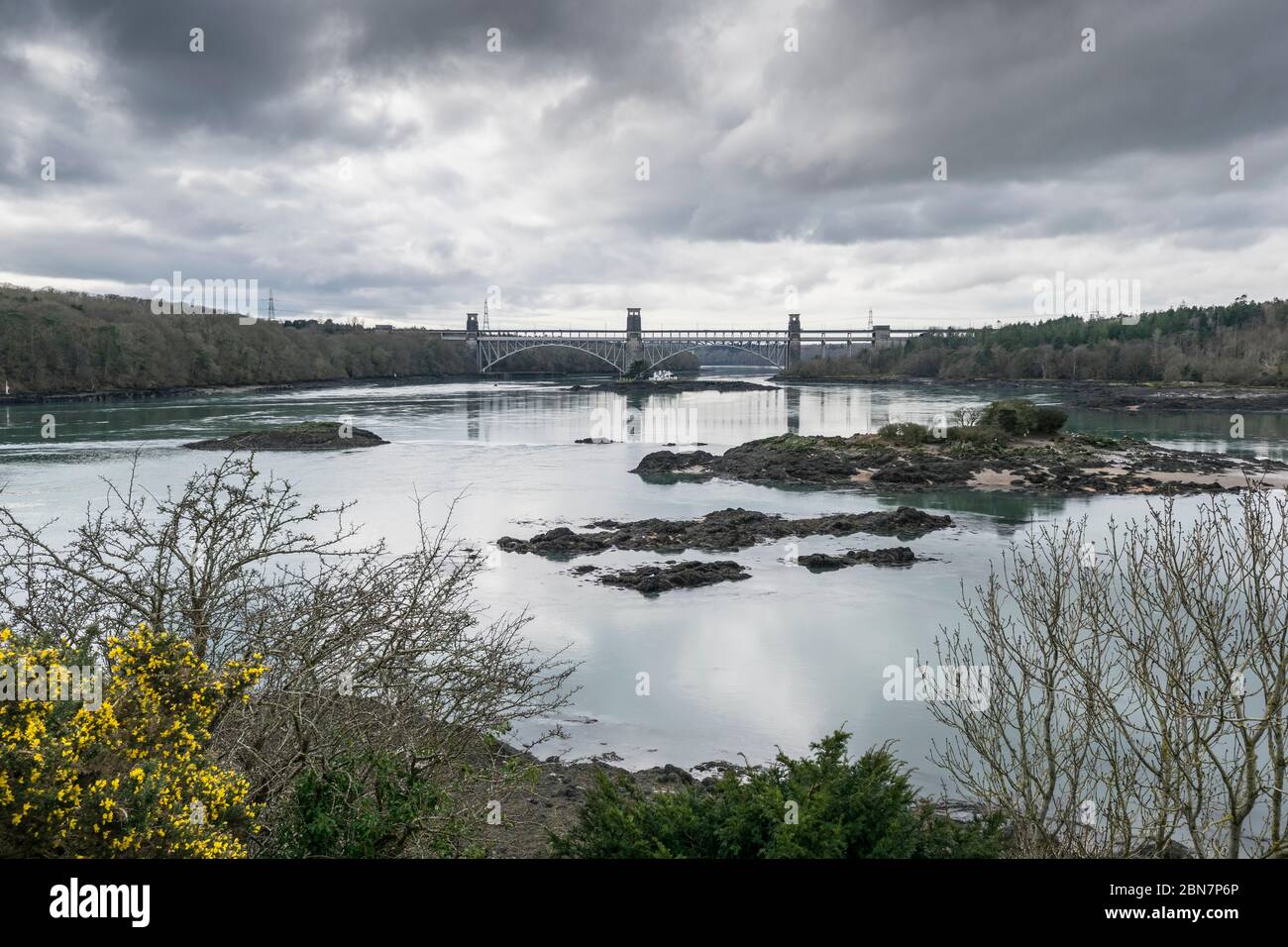 Church Island at Porthaethwy Anglesey in North Wales looking towards Pont Brittania on the Menai Straits from St Tysilio church graveyard Stock Photo