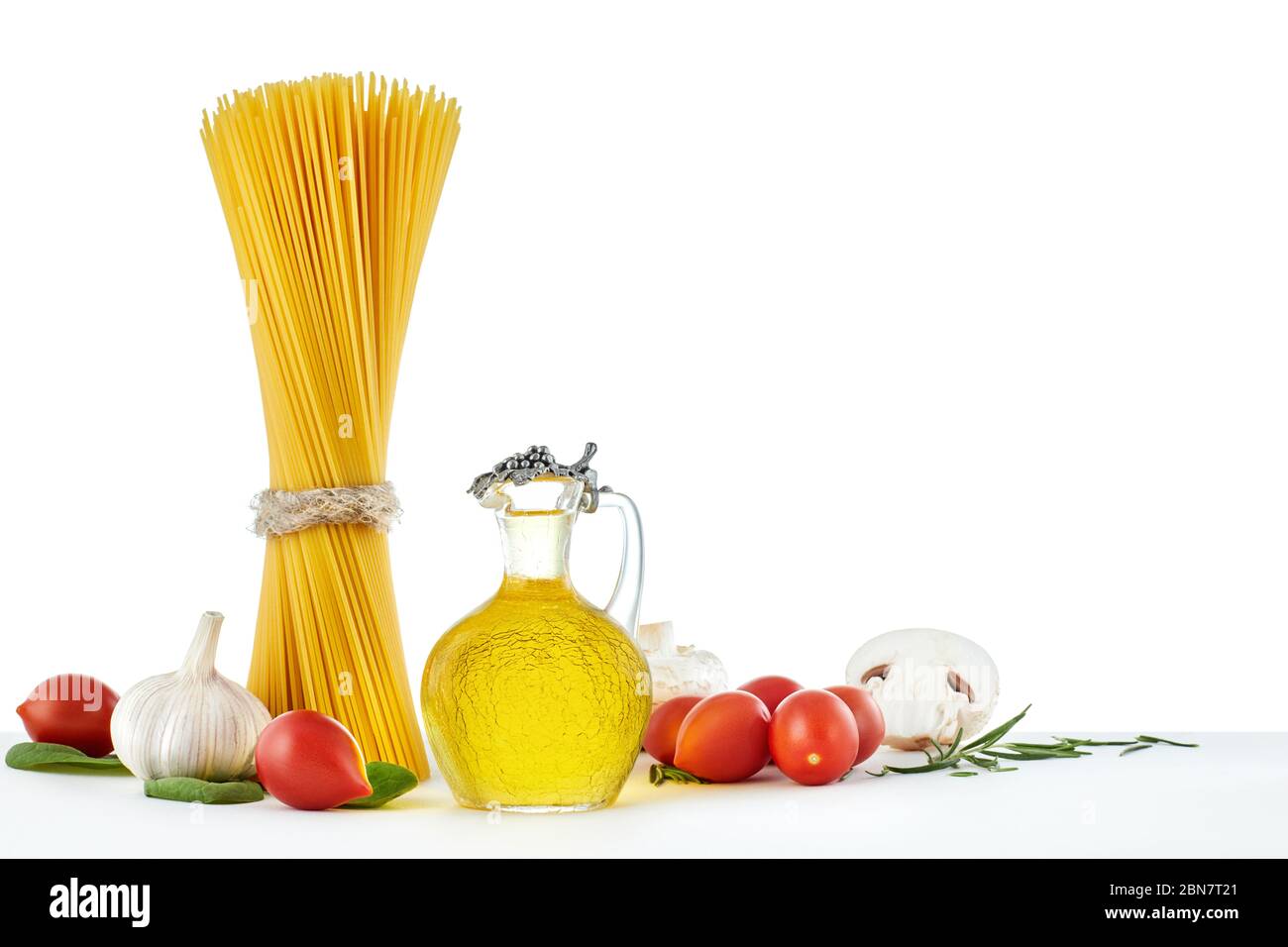 italian raw dry pasta spaghetti, olive oil and vegetables isolated on ...