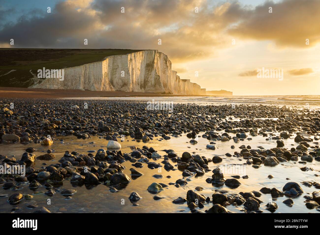 Sunrise over the Seven Sisters Cliffs and shingle beach, Eastbourne, East Sussex, England, United Kingdom, Europe Stock Photo