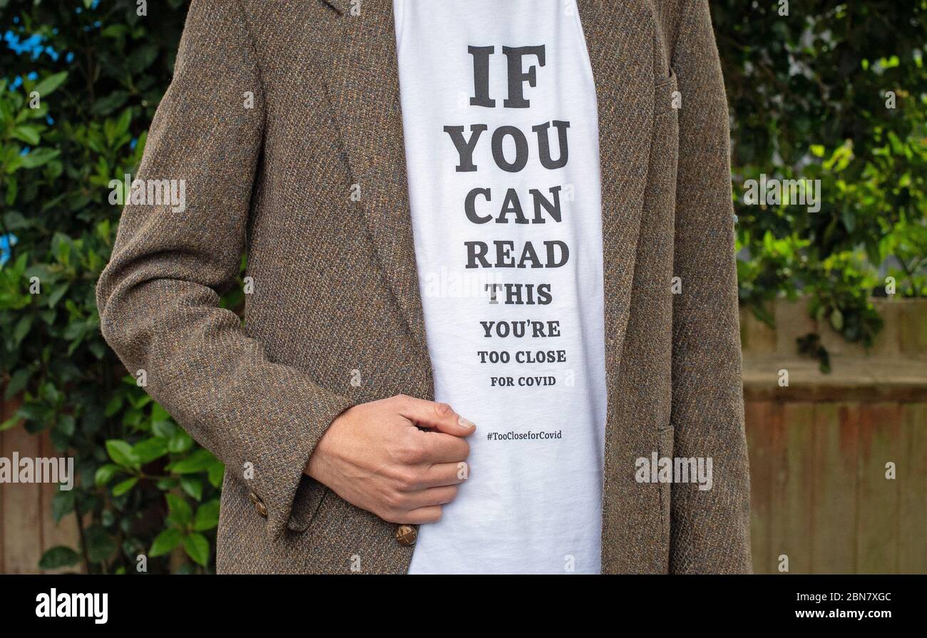 A T-shirt which include the slogan: 'If you can read this, you’re too close for COVID' from a range that has been launched by the global brand transformation company FutureBrand as a not-for-profit initiative to help reinforce key social distancing guidelines as the nation emerges from the coronavirus pandemic lockdown. Stock Photo