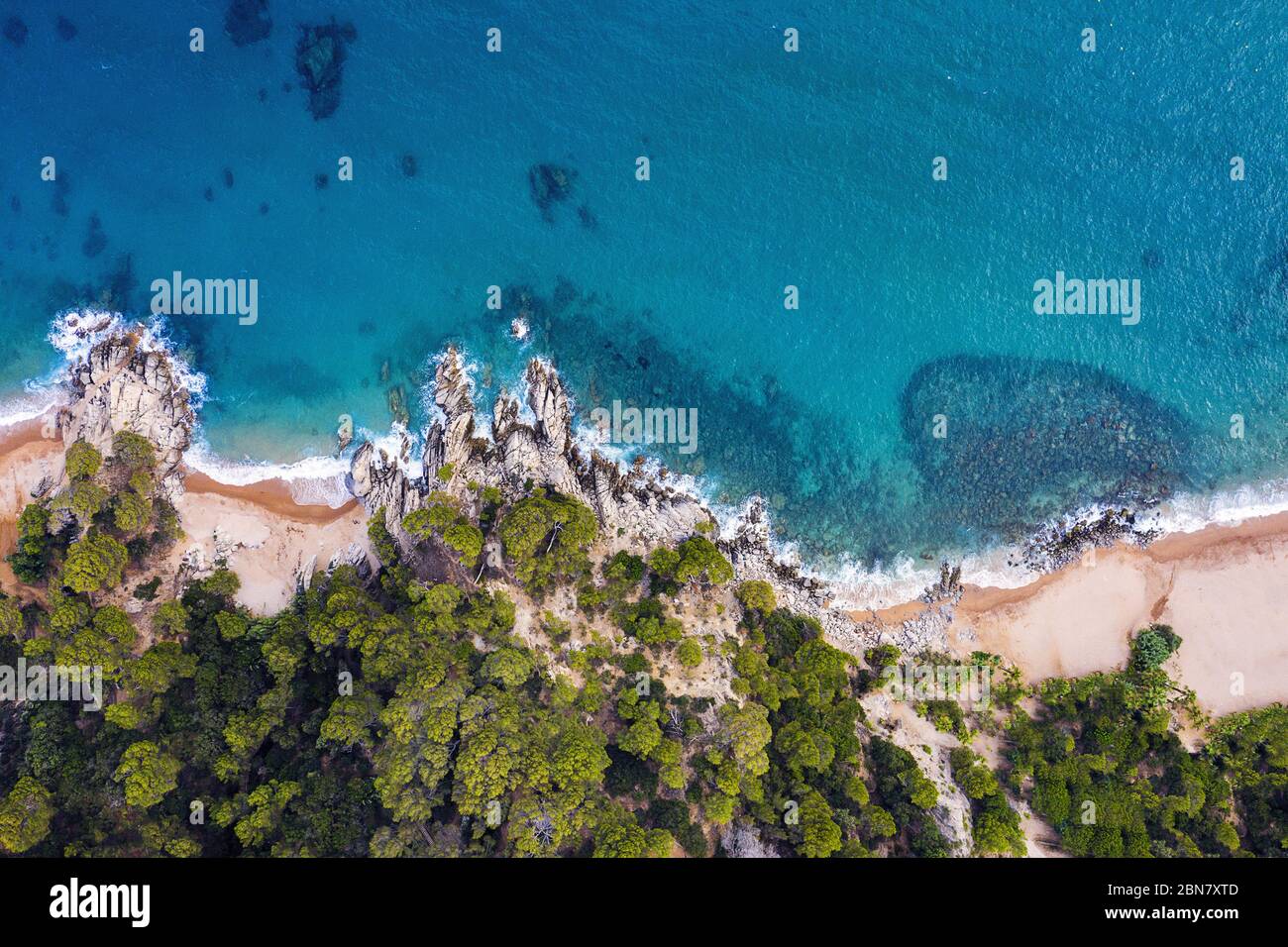 aerial top view of the coastline with beach and coves of turquoise ...