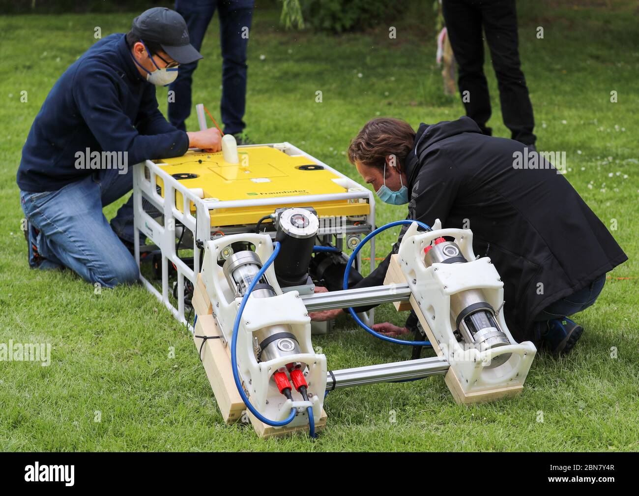 13 May 2020, Saxony-Anhalt, Seegebiet Mansfelder Land: Members of a research group are mounting a high-resolution 3D laser on a diving robot for an assignment in the Süßes See. With this new technique, a more than 3000 year old Bronze Age tomb and the remains of a medieval settlement are being surveyed at the lake's bottom. The technique is being used for the first time in Germany. With the new device not only individual buildings but complete structures can be recorded. The laser measures under water with millimetre precision and generates spatial images. In the last two years, archaeologists Stock Photo