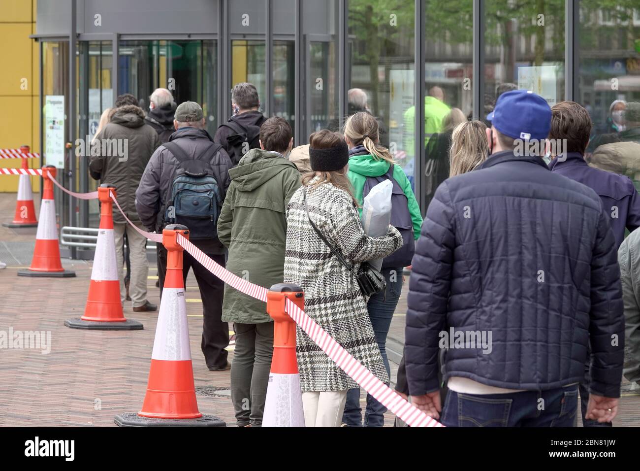 Hamburg, Germany. 13th May, 2020. Customers walk behind red and white barriers to the Ikea branch in Altona. The furniture store in Hamburg-Altona is reopened today after closing due to the corona epidemic. Distance regulations and a comprehensive safety and hygiene concept apply. Credit: Bodo Marks/dpa/Alamy Live News Stock Photo