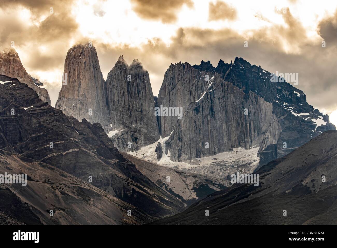 The Cordillera Paine mountain range with the three Torres del Paine. (North, or Torres Monzino, tower to the right.) Stock Photo