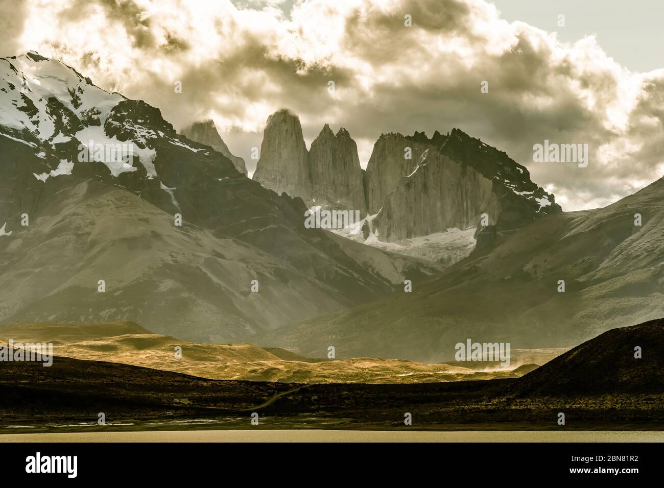 The Cordillera Paine mountain range with the three Torres del Paine. (North, or Torres Monzino, tower to the right.) Stock Photo