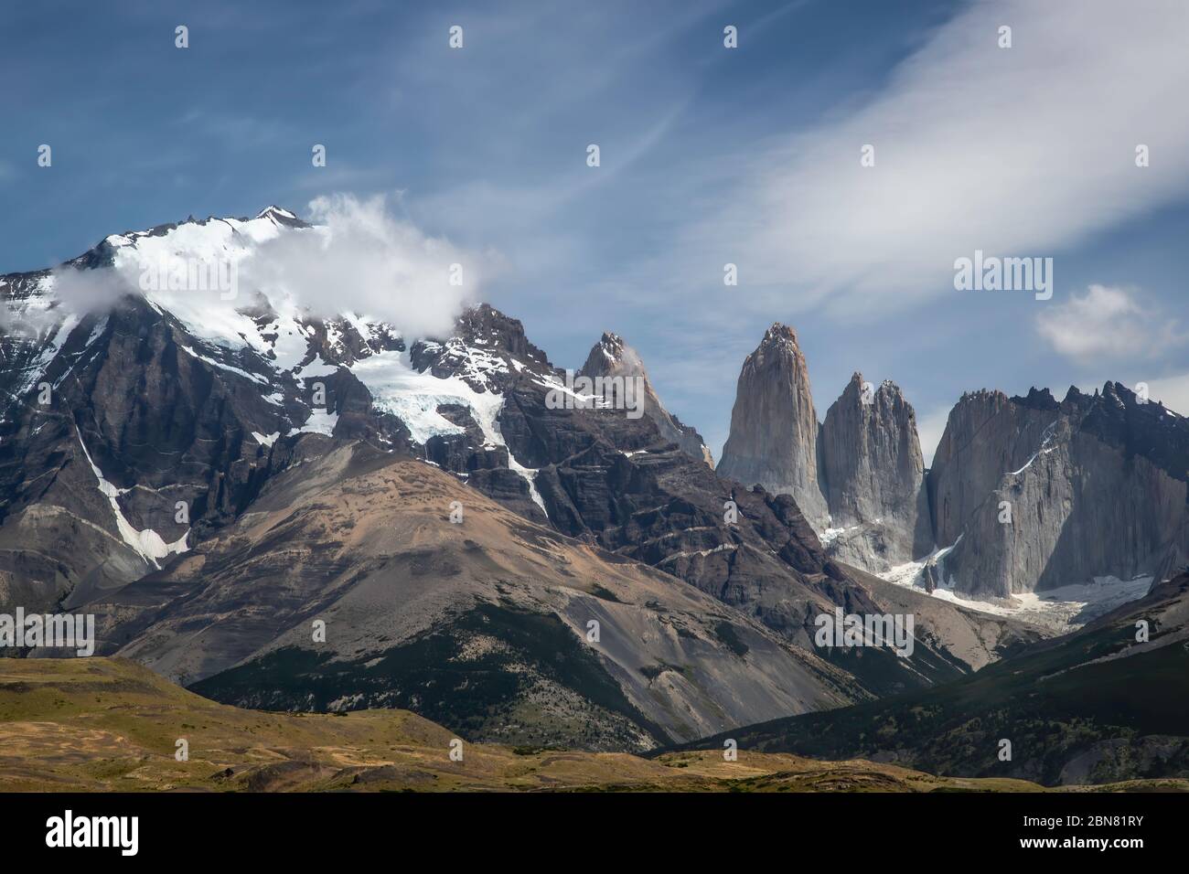 The Cordillera Paine mountain range with the three Torres del Paine. (North, or Torres Monzino, tower to the right.) Stock Photo