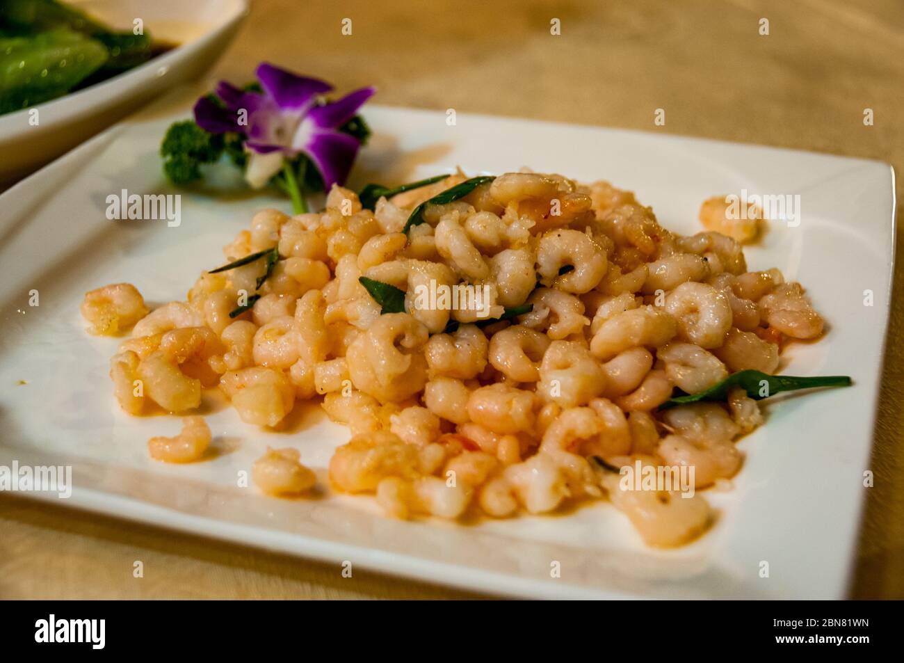 A dish of Longjing shrimps a traditional Hangzhou dish served at the famous Louwailou Restaurant on Gushan Island, Hangzhou Stock Photo
