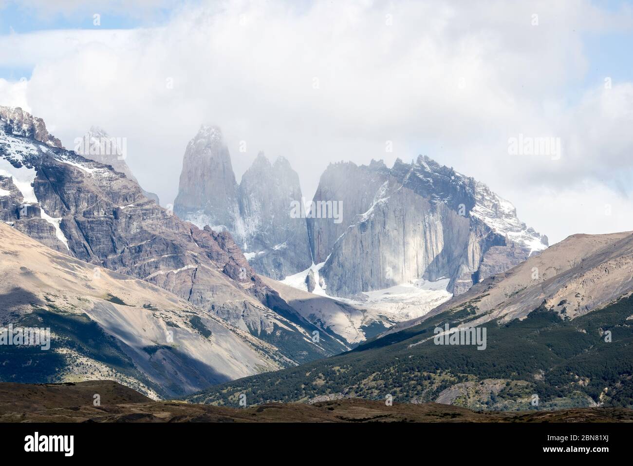 The Cordillera Paine mountain range with the three Torres del Paine. (North, or Torres Monzino, tower to the right.) Stock Photo
